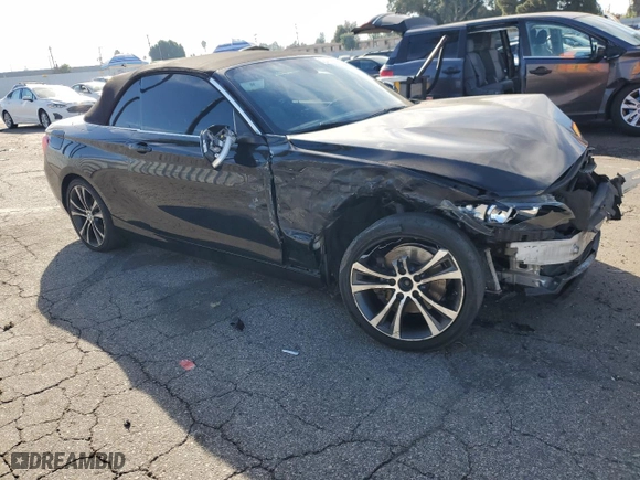 2015 BMW 2 Series 228i with VIN WBA1K5C59FV242992, listed as a Copart auction lot 75433654 with 0 mi miles and Salvage Title. Bid and sale history available at carsss.com. Image 4.