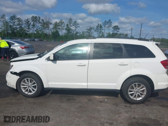 2015 Dodge Journey SXT with VIN 3C4PDCBG0FT653857, listed as a IAAI auction lot 42128410 with 182,960 mi miles and . Bid and sale history available at DreamBid. Image 14.