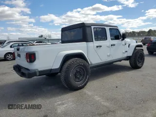2023 Jeep Gladiator Sport S with VIN 1C6HJTAG4PL556387, listed as a Copart auction lot 47453305 with 35,611 mi miles and Salvage title. Bid and sale history available at DreamBid. Image 3.