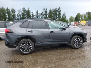 2021 Toyota RAV4 Hybrid XSE with VIN 2T3E6RFV4MW004081, listed as a IAAI auction lot 42300195 with 63,238 mi miles and . Bid and sale history available at DreamBid. Image 13.