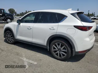 2018 Mazda CX-5 Grand Touring z VIN JM3KFADM3J1464073, wystawiony jako Copart lot #59571385 z przebiegiem Nie podano mil oraz Szkoda całkowita • Salvage title. Historia ofert i sprzedaży dostępna na DreamBid. Obrazek 2.