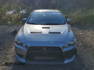 2014 Mitsubishi Lancer Evolution GSR z VIN JA32W8FV6EU018171, wystawiony jako Copart lot #77109934 z przebiegiem 83 467 mil mil oraz Tytuł czysty. Historia ofert i sprzedaży dostępna na DreamBid. Obrazek 5.