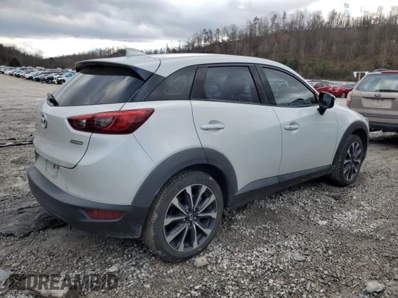 2019 Mazda CX-3 Touring with VIN JM1DKFC78K0405131, listed as a Copart auction lot 87065614 with 91,091 mi miles and Salvage Title. Bid and sale history available at carsss.com. Image 3.