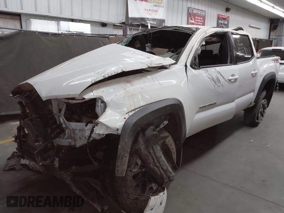 2023 Toyota Tacoma SR with VIN 3TMCZ5ANXPM652495, listed as a IAAI auction lot 42375230 with 26,736 mi miles and . Bid and sale history available at DreamBid. Image 2.