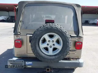 2003 Jeep Wrangler X with VIN 1J4FA39S03P312550, listed as a IAAI auction lot 41837150 with 127,239 mi miles and . Bid and sale history available at DreamBid. Image 16.
