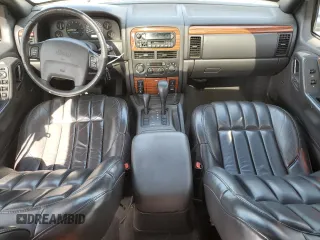 1999 Jeep Grand Cherokee Limited with VIN 1J4GW68N4XC679841, listed as a Copart auction lot 59760015 with 155,366 mi miles and Salvage title. Bid and sale history available at DreamBid. Image 8.
