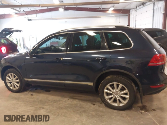 2014 Volkswagen Touareg Sport with VIN WVGEF9BP9ED008967, listed as a IAAI auction lot 41984409 with 193,859 mi miles and . Bid and sale history available at DreamBid. Image 14.