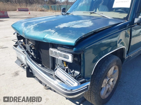 1999 Chevrolet Tahoe Z71 z VIN 1GNEK13R2XJ325602, wystawiony jako IAAI lot #41590107 z przebiegiem 204 611 mil mil oraz . Historia ofert i sprzedaży dostępna na DreamBid. Obrazek 6.