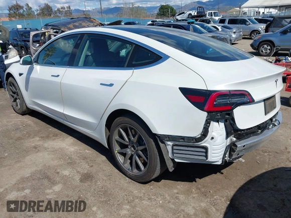 2020 Tesla Model 3 Standard Range Plus with VIN 5YJ3E1EA4LF644967, listed as a IAAI auction lot 41745984 with 23,479 mi miles and . Bid and sale history available at DreamBid. Image 3.