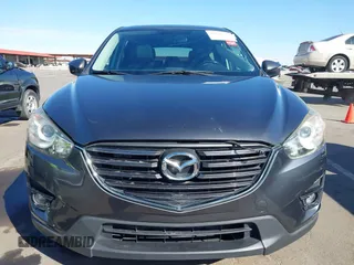 2016 Mazda CX-5 Grand Touring z VIN JM3KE2DYXG0649781, wystawiony jako IAAI lot #41636329 z przebiegiem 83 433 mil mil oraz . Historia ofert i sprzedaży dostępna na DreamBid. Obrazek 12.
