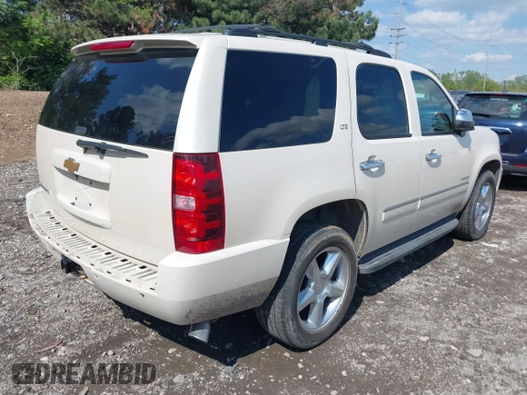 2013 Chevrolet Tahoe LTZ with VIN 1GNSKCE07DR326996, listed as a IAAI auction lot 42203073 with 147,067 mi miles and . Bid and sale history available at DreamBid. Image 4.