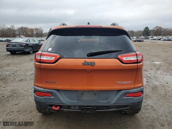 2015 Jeep Cherokee Trailhawk with VIN 1C4PJMBSXFW704942, listed as a Copart auction lot 85514044 with 194,340 mi miles and Salvage Title. Bid and sale history available at carsss.com. Image 6.