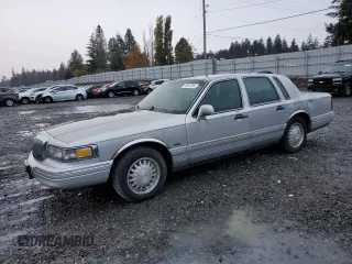 1997 Lincoln Town Car Cartier with VIN 1LNLM83W1VY631859, listed as a Copart auction lot 78545784 with 199,783 mi miles and Salvage title. Bid and sale history available at DreamBid. Image 1.