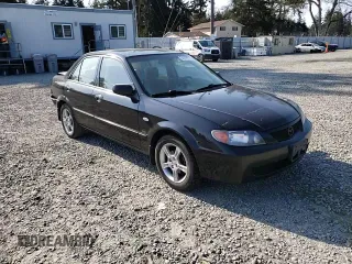2003 Mazda Protege DX with VIN JM1BJ226231214537, listed as a Copart auction lot 54448615 with 147,753 mi miles and Salvage Title. Bid and sale history available at DreamBid. Image 13.