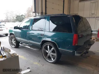 1997 Chevrolet Tahoe with VIN 1GNEK13R8VJ411512, listed as a IAAI auction lot 41583085 with 239,481 mi miles. Bid and sale history available at carsss.com. Image 3.