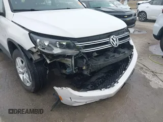 2013 Volkswagen Tiguan S z VIN WVGAV3AX6DW610678, wystawiony jako IAAI lot #41544865 z przebiegiem 102 948 mil mil oraz . Historia ofert i sprzedaży dostępna na DreamBid. Obrazek 6.
