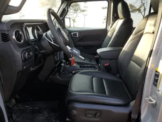2024 Jeep Wrangler Sahara with VIN 1C4RJXP60RW128448, listed as a Copart auction lot 48658135 with 5,879 mi miles and Salvage Title. Bid and sale history available at DreamBid. Image 7.