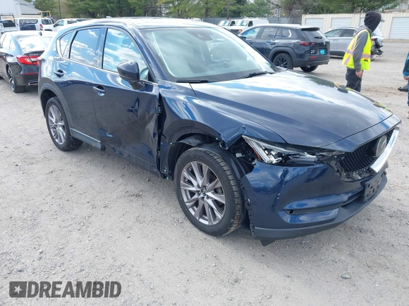2019 Mazda CX-5 Grand Touring with VIN JM3KFBDM2K0603400, listed as a IAAI auction lot 42051135 with 59,448 mi miles and . Bid and sale history available at DreamBid. Image 1.