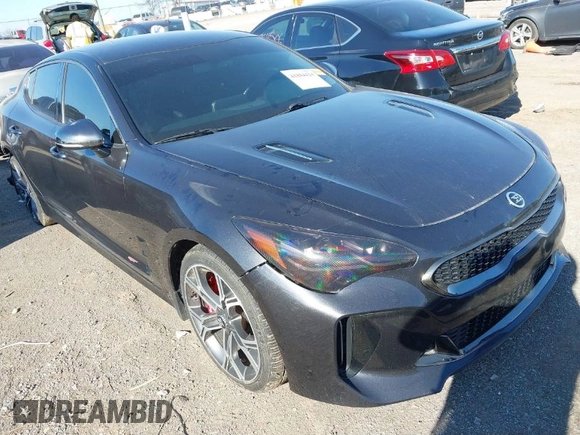 2021 Kia Stinger GT with VIN KNAE35LC4M6097199, listed as a IAAI auction lot 41884424 with 61,490 mi miles. Bid and sale history available at carsss.com. Image 1.