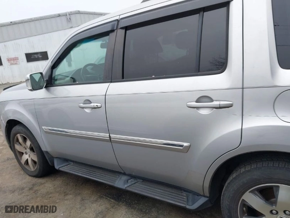 2015 Honda Pilot Touring with VIN 5FNYF4H90FB009965, listed as a IAAI auction lot 41726660 with 232,829 mi miles. Bid and sale history available at carsss.com. Image 14.