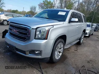 2015 GMC Yukon SLE with VIN 1GKS1AKC8FR540627, listed as a IAAI auction lot 42004023 with 128,195 mi miles. Bid and sale history available at carsss.com. Image 2.