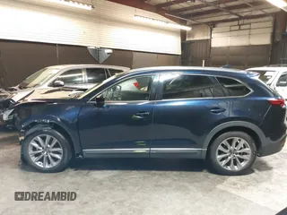 2020 Mazda CX-9 Grand Touring with VIN JM3TCBDY4L0403376, listed as a IAAI auction lot 42357363 with 86,716 mi miles and . Bid and sale history available at DreamBid. Image 14.