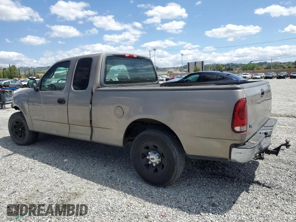 2001 Ford F-150 with VIN 1FTPX17L21NA37619, listed as a Copart auction lot 56922485 with 212,148 mi miles and Salvage title. Bid and sale history available at DreamBid. Image 2.
