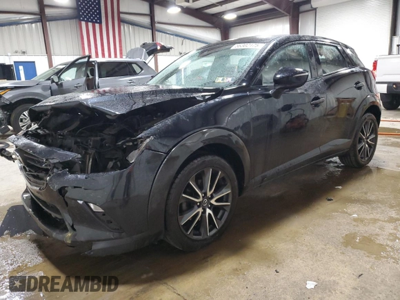 2018 Mazda CX-3 Touring z VIN JM1DKFC75J0301307, wystawiony jako Copart lot #56302175 z przebiegiem 107 676 mil mil oraz Szkoda całkowita • Salvage title. Historia ofert i sprzedaży dostępna na DreamBid. Obrazek 1.