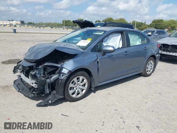 2023 Toyota Corolla Hybrid LE with VIN JTDBCMFE8PJ010693, listed as a IAAI auction lot 41736641 with 10,751 mi miles. Bid and sale history available at carsss.com. Image 2.