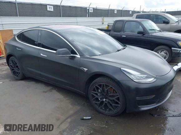 2018 Tesla Model 3 Long Range Battery with VIN 5YJ3E1EA7JF012249, listed as a IAAI auction lot 41782972 with 103,412 mi miles. Bid and sale history available at carsss.com. Image 1.