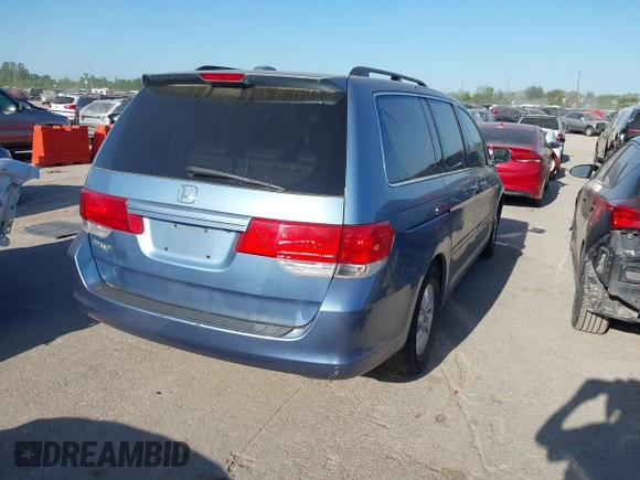 2009 Honda Odyssey EX-L with VIN 5FNRL38759B001130, listed as a IAAI auction lot 42004710 with 142,126 mi miles and . Bid and sale history available at DreamBid. Image 4.