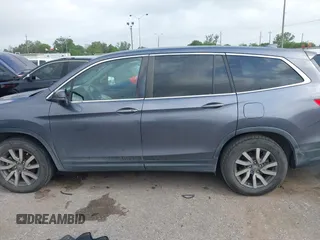 2020 Honda Pilot EX-L z VIN 5FNYF5H55LB028509, wystawiony jako IAAI lot #41945843 z przebiegiem Nie podano mil oraz . Historia ofert i sprzedaży dostępna na DreamBid. Obrazek 14.