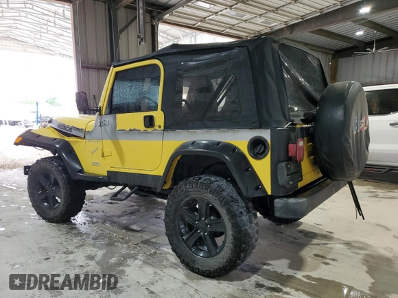 2002 Jeep Wrangler Sport z VIN 1J4FA49S02P730417, wystawiony jako Copart lot #59620865 z przebiegiem Nie podano mil oraz Szkoda całkowita • Salvage title. Historia ofert i sprzedaży dostępna na DreamBid. Obrazek 2.