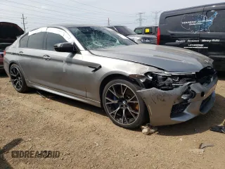 2018 BMW M5 z VIN WBSJF0C50JB283220, wystawiony jako Copart lot #62178853 z przebiegiem Nie podano mil oraz . Historia ofert i sprzedaży dostępna na DreamBid. Obrazek 4.