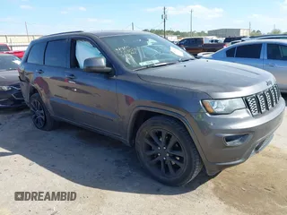 2018 Jeep Grand Cherokee Altitude with VIN 1C4RJFAGXJC303127, listed as a IAAI auction lot 41822541 with 102,707 mi miles and . Bid and sale history available at DreamBid. Image 1.