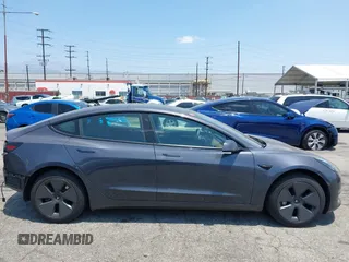 2023 Tesla Model 3 with VIN 5YJ3E1EA4PF400306, listed as a IAAI auction lot 42398603 with 18,551 mi miles and . Bid and sale history available at DreamBid. Image 14.