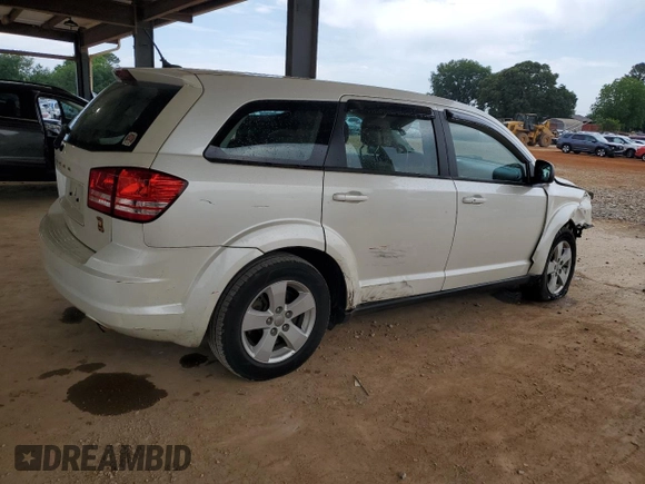 2013 Dodge Journey American Value with VIN 3C4PDCAB5DT656997, listed as a Copart auction lot 57123565 with 201,799 mi miles and Salvage title. Bid and sale history available at DreamBid. Image 3.