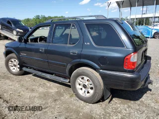2002 Isuzu Rodeo S z VIN 4S2CK58W924321032, wystawiony jako Copart lot #66145264 z przebiegiem 184 325 mil mil oraz Szkody całkowita. Historia ofert i sprzedaży dostępna na DreamBid. Obrazek 2.