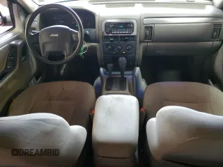 2004 Jeep Grand Cherokee Laredo with VIN 1J4GW48S04C164745, listed as a Copart auction lot 64036725 with 163,054 mi miles and Salvage title. Bid and sale history available at DreamBid. Image 8.