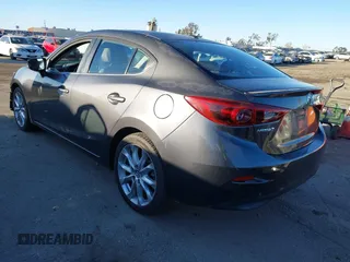 2014 Mazda 3 S Grand Touring with VIN JM1BM1W36E1112033, listed as a IAAI auction lot 41412655 with 115,050 mi miles and . Bid and sale history available at DreamBid. Image 3.