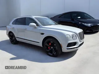 2017 Bentley Bentayga W12 z VIN SJAAC2ZV2HC014791, wystawiony jako Copart lot #51292615 z przebiegiem 53 570 mil mil oraz Tytuł czysty. Historia ofert i sprzedaży dostępna na DreamBid. Obrazek 1.