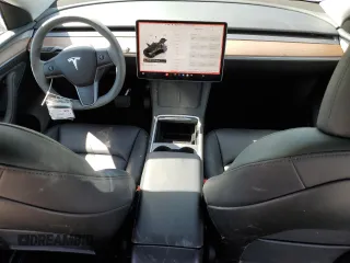 2024 Tesla Model Y Long Range z VIN 7SAYGAEE3RF089122, wystawiony jako Copart lot #52732035 z przebiegiem 15 486 mil mil oraz Szkoda całkowita • Salvage title. Historia ofert i sprzedaży dostępna na DreamBid. Obrazek 8.