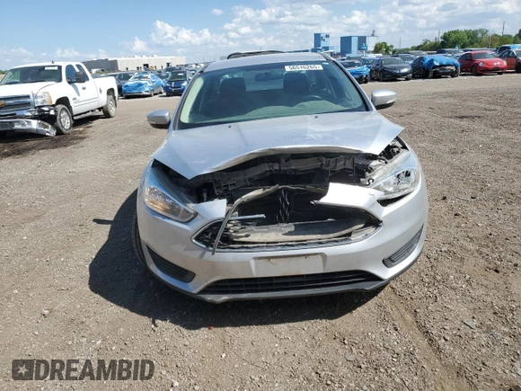 2017 Ford Focus SE z VIN 1FADP3F24HL308294, wystawiony jako Copart lot #56516265 z przebiegiem 80 431 mil mil oraz Szkoda całkowita • Salvage title. Historia ofert i sprzedaży dostępna na DreamBid. Obrazek 5.