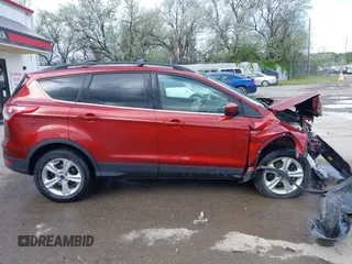 2014 Ford Escape SE z VIN 1FMCU9GX8EUB98766, wystawiony jako IAAI lot #42256143 z przebiegiem 64 074 mil mil oraz . Historia ofert i sprzedaży dostępna na DreamBid. Obrazek 14.