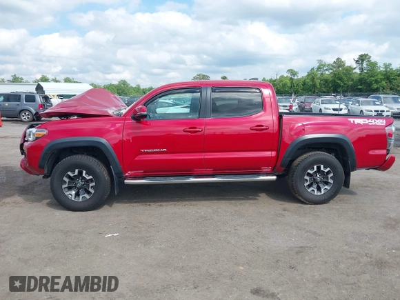 2021 Toyota Tacoma SR z VIN 5TFCZ5AN2MX263159, wystawiony jako IAAI lot #42273087 z przebiegiem 69 220 mil mil oraz . Historia ofert i sprzedaży dostępna na DreamBid. Obrazek 13.
