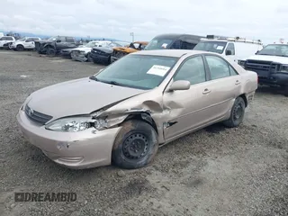 2002 Toyota Camry LE z VIN 4T1BE32K72U028489, wystawiony jako IAAI lot #41760604 z przebiegiem 163 950 mil mil oraz . Historia ofert i sprzedaży dostępna na DreamBid. Obrazek 18.