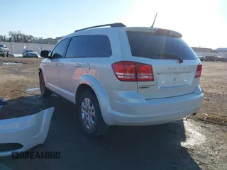 2017 Dodge Journey SE z VIN 3C4PDCAB3HT707029, wystawiony jako IAAI lot #41406306 z przebiegiem 104 046 mil mil oraz . Historia ofert i sprzedaży dostępna na DreamBid. Obrazek 3.