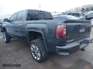 2018 GMC Sierra 1500 Denali with VIN 3GTU2PEJ8JG571593, listed as a IAAI auction lot 41169420 with 98,501 mi miles. Bid and sale history available at carsss.com. Image 3.