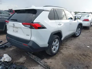 2020 Toyota RAV4 XLE with VIN JTMW1RFV0LD521893, listed as a IAAI auction lot 42701228 with 34,647 mi miles and . Bid and sale history available at DreamBid. Image 4.