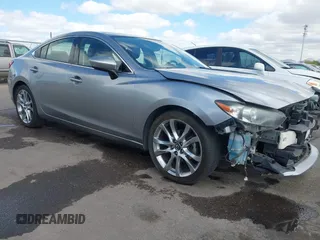 2014 Mazda 6 i Grand Touring with VIN JM1GJ1W57E1104801, listed as a IAAI auction lot 42060144 with 95,212 mi miles. Bid and sale history available at carsss.com. Image 1.